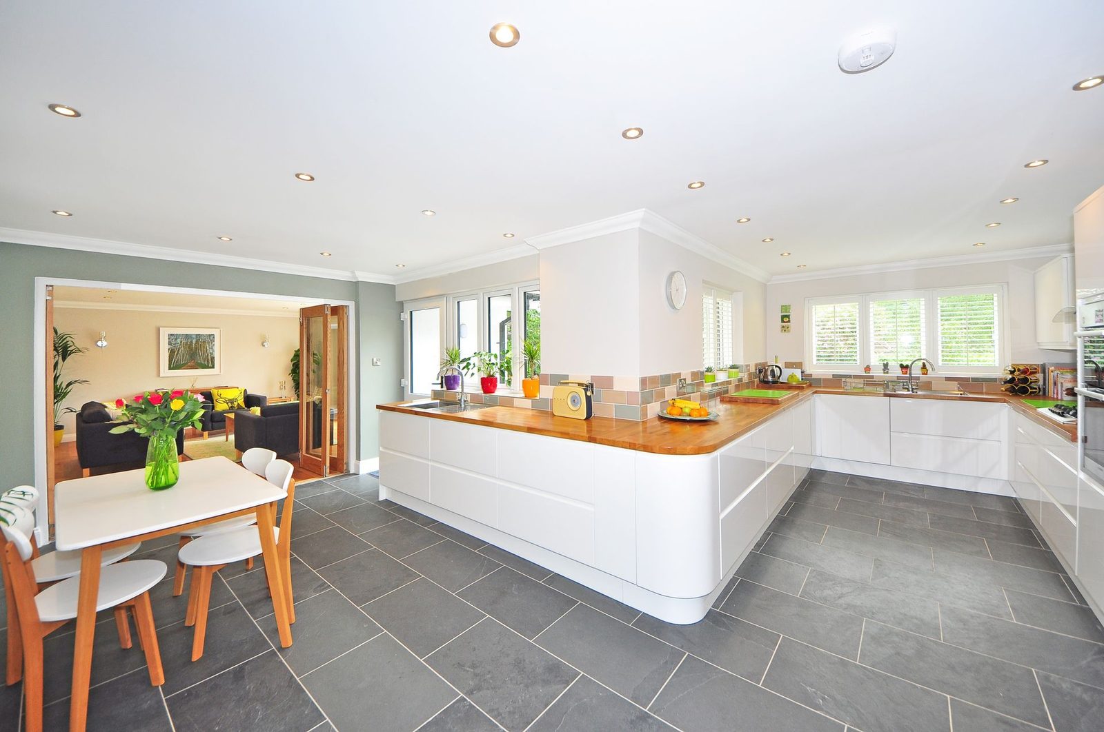 Solid timber double doors between a kitchen and living room